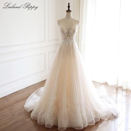 Lceland Poppy A-line Tulle Wedding Dresses Plus Size Illusion Lace Appliques Floor Length Crystal Beaded Bridal Dress
