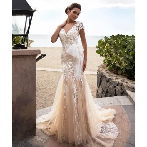 Modest Champagne Mermaid Wedding Dresses Embroidery Sweep Train Lace Applique Covered Buttons Sheer Neck Custom Made Beach Weddi