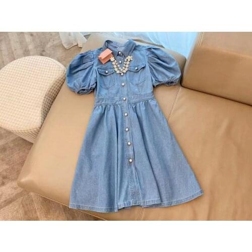 Summer new blue Lapel bubble sleeve denim dress with flower metal chain decoration and large body knitted button design