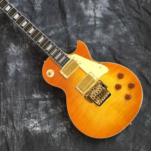 Wholesale and retail new golden tremolo guitar electric guitar high quality good sound quality free shipping