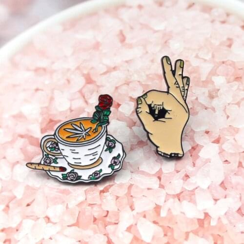 Perfect life style elegant coffee cup dress up with rose lipstick and "ok" gesture brooch for glamour women to join the party