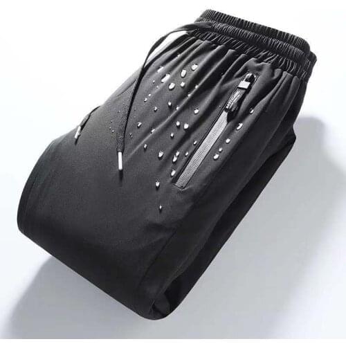 2021 new down pants winter thickening warm wind-proof white duck down foot pants over the cold sweatpants Down Padded Trousers