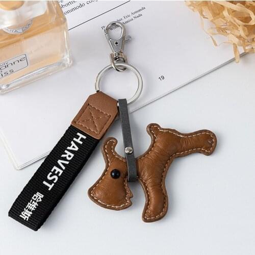 Jaeeyin 2021 New Arrivals Fashion Jewelry Cute Dog Charm Hand Made Brown Black Leather Key Chain Keychain Gift Girls Teen Boys