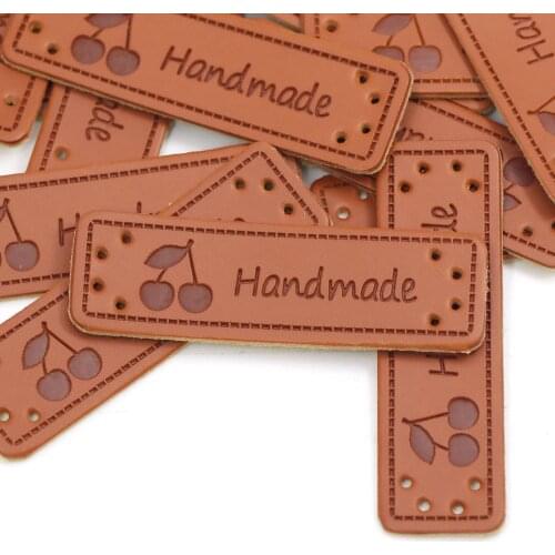 50Pcs 50x15mm Handmade Tags PU Faux Leather Labels Handmade Cherry Knitting Label For Clothes/Bag/Hat/Scarf Sew Accessories DIY
