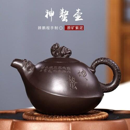 Wholesale Gu Pengcheng manual raw ore purple clay engraving lettering teapot Kung Fu tea set wholesale customization