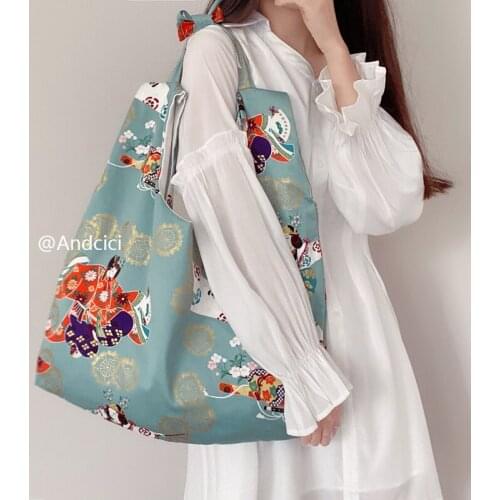 Design sense gem green Buddha girl bag canvas shoulder bag portable shopping bag student bag