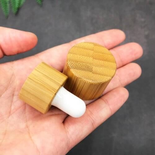Wooden cap for essential oil glass bottle 1oz glass dropper bottle with bamboo cap glass essential oil bottle cosmetic packaging