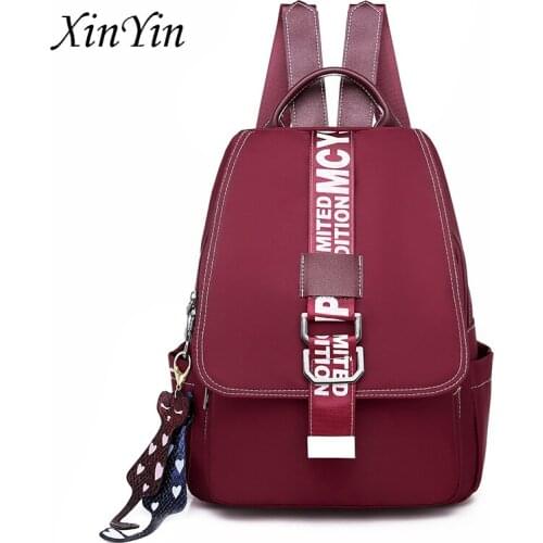 Europe and America fashion letter cartoon pendant backpack women school bag for teenage girls wild light ladies travel backpack