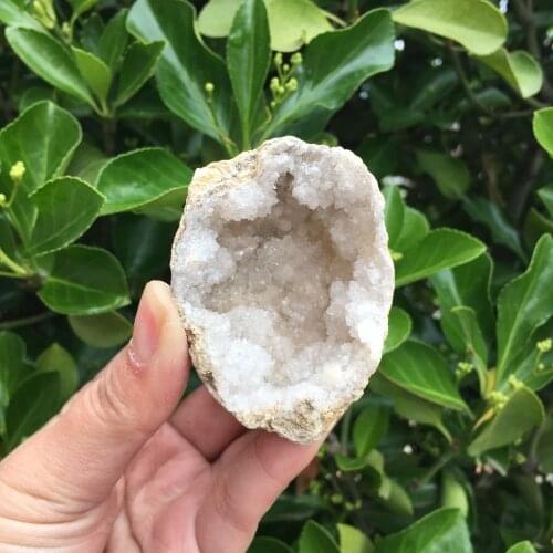 Natural agate geode crystal hole Mineral specimen contains clean crystal clusters of very beautiful small stones and crystals