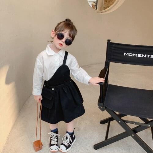 Childrens dress 2021 autumn new Korean boys' and girls' strap dress childrens solid color strap dress