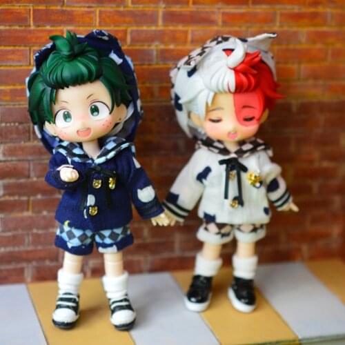 OB11 Doll Clothing is a 4 piece suit with a 1/12 size stylish white all-match top + checkered shorts + simple hat + white socks