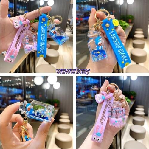 2021 Creative Cute Daisy Fruit Milk Bottle Keychain Floating Moving Liquid Quicksand Drift Bottle Keyring For Women Bag Pendan
