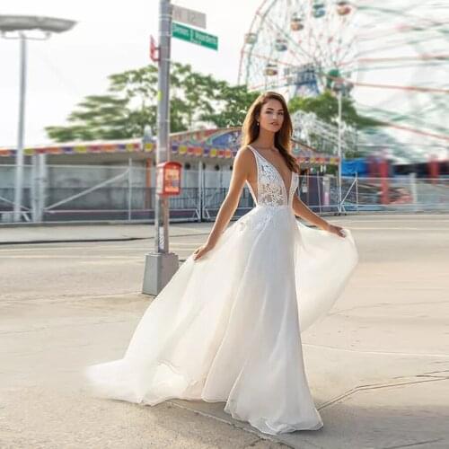Ivory Organza a-Line Bridal Gown Plunging v-Neckline Edged With Embroidered Lace Bodice With Nude Underlay Wedding Dress