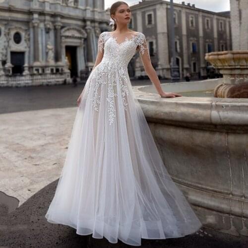 Scoop Long Sleeves Appliques Lace Buttons Tulle A-Line Wedding Dress 2021 Vestido De Noiva Bridal Gown