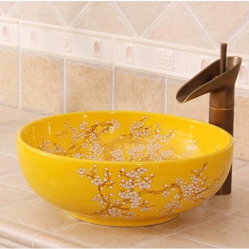 China Artistic Handmade Yellow plum blossom Painting Ceramic wash basin Round Counter top wash sink ceramic hand painted