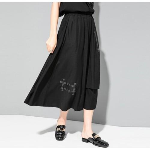 Dark cold wind personalized stitching bright line decoration irregular fashion skirt summer show thin a version medium and long