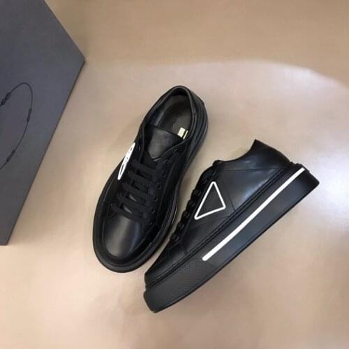 Mens thick-soled casual sneakers soft calfskin leather decorated with a rubber triangle logo which is unique in design