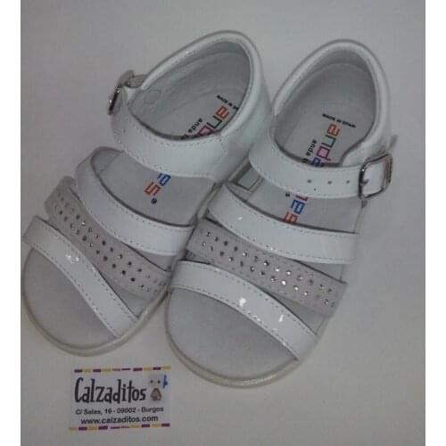 In finishing patent leather and suede sandals with buckle, Andanines