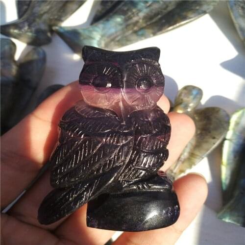 2inch The owl, carved in natural colored fluorite, is beautifully decorated