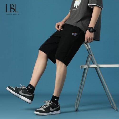 Casual Printed Mens Shorts Summer Loose Solid Shorts Clothing Male Breathable Elastic Waist Embroidery Label Fashion Shorts New