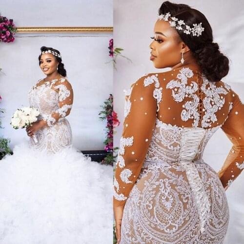 Plus Size African Mermaid Wedding Dresses 2021 Nude Lining White Lace Appliqued Illusion Long Sleeve Beaded Pearls Bridal