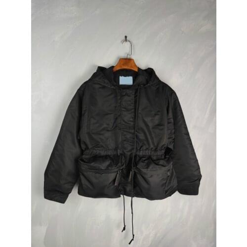 AM003 The black hooded coat has a thick trench coat style with a waist tuck