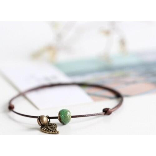 2 pieces / lot New Ceramic Anklet Single Bead and Leaf Hand Woven Fashion Style Popular Female Anklet with bell