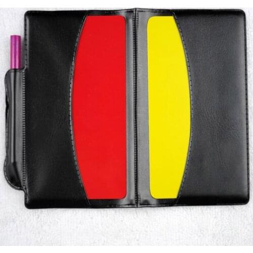Ordinary Large Football with Leather Case Red Cards and Yellow Cards the Referee Records the Penalty Card