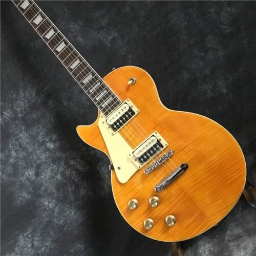 Standard left-handed electric guitar, good sound quality, yellow, top flame maple