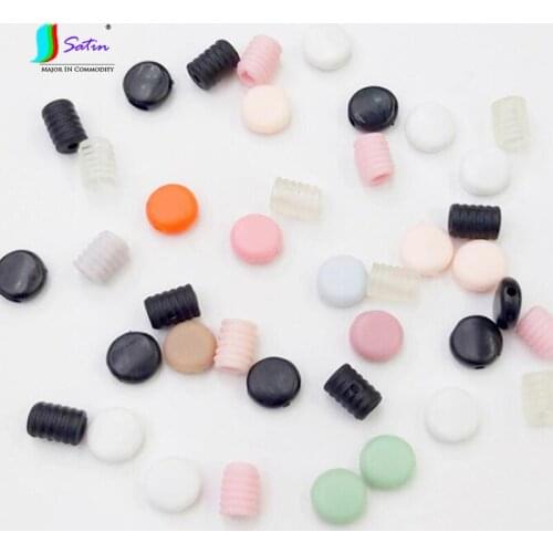 Wholesale Black White Soft Non-Toxic Plastic Silicone Flat Button Spiral Button Adult Children Elastic Band Adjusting Buckle
