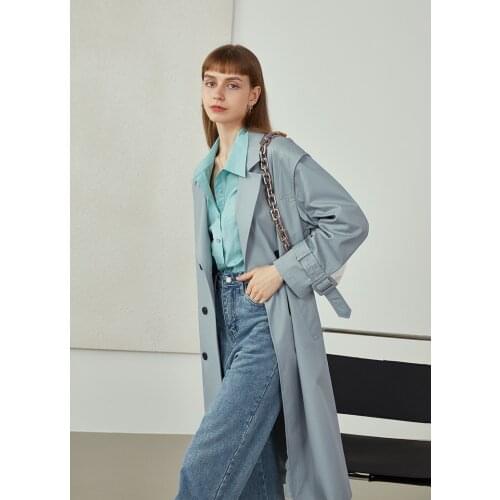 Temperament and popular long windbreaker jacket women 2021 new autumn design sense of advanced