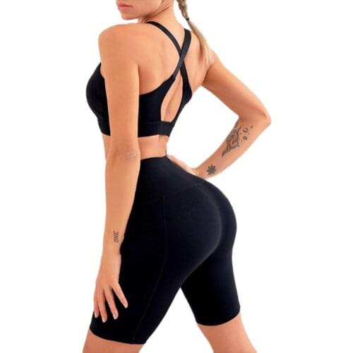 New European and American short five-quarter pants yoga suit cross shock resistant bra high waist pocket peach yoga suit two pie