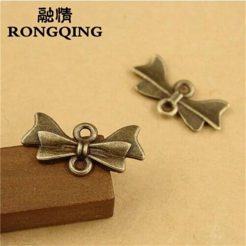 RONGQING 100pcs/lot 21*10MM Bow tie alloy Bronze Charms handmade Craft pendant making fit DIY for bracelet necklace