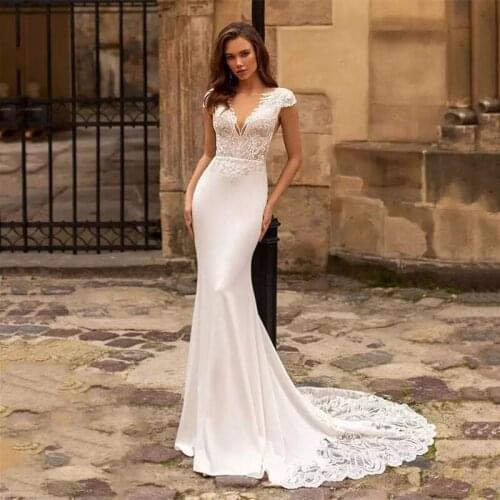Gorgeous Mermaid Wedding Dresses 2021 Cap Sleeve V-Neck Lace Appliques Sequined Sexy Open Back Sweep Train Ivory Bride Gown