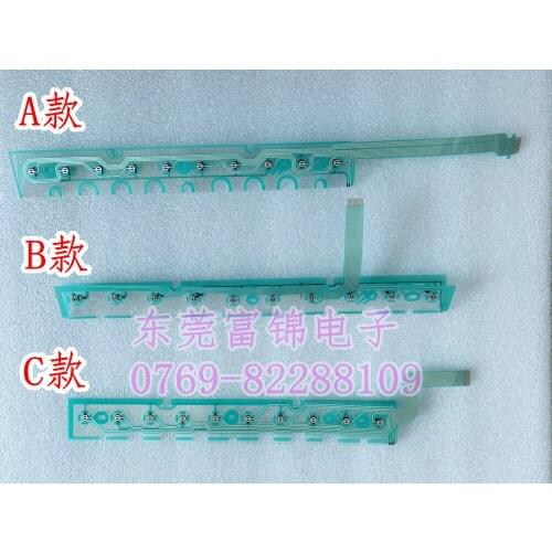 New OKUMA button film button strip