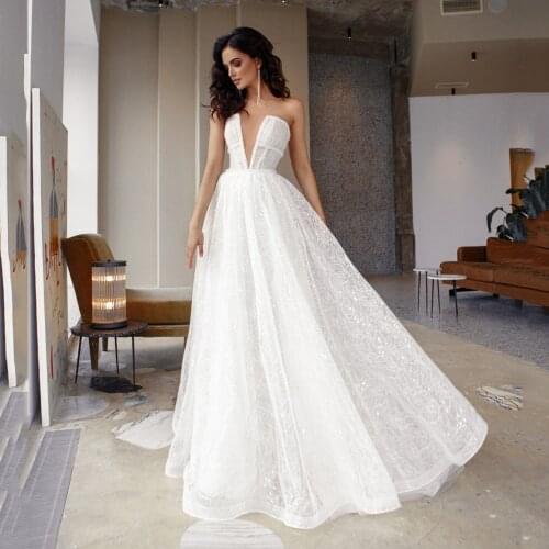 UZN Sexy A Line See Through Glitter Wedding Dress Deep V Neck Sequined Lace Bridal Gown Beading Belt Brides Dress