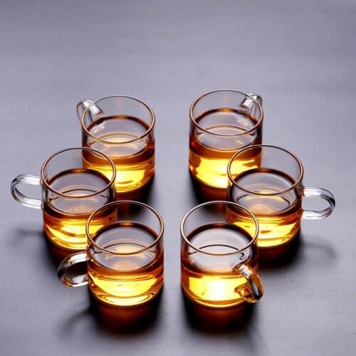 Thickened heat-resistant glass flower tea straight handle cup transparent belt handle borosilicate cup Kung Fu tea cup