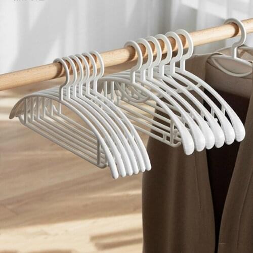 China hot sales seamless clothes hanger strong plastic anti-slip clothing supporter solid color drying rack