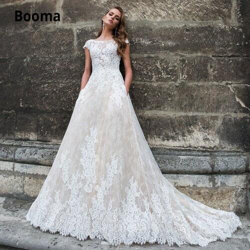 Booma Full Appliques Lace Boho Wedding Dress with Pockets 2020 O-neck Cap Sleeve Backless A-line Beach Bridal Gowns Plus Size