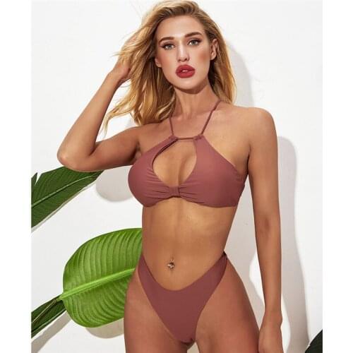 The new European and American solid color halter neck and halter back sexy split bikini swimsuit woman