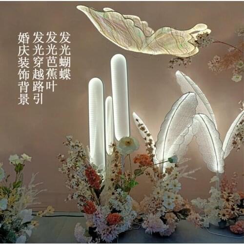 New wedding background decoration props feather light banana leaf butterfly through the road guide wedding window stage