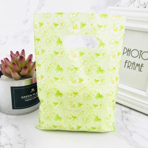 New Design 15x20cm Yellow green small floral Jewelry Plastic Bag With Handles 100pcs Shopping Bag Packaging Wedding Decoration