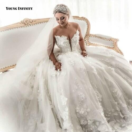 Romantic Ball Gown Wedding Dresses 2021 Sleeveless Bridal Gown Backless V Neck Cathedral Train Applique White Plus Size Bride