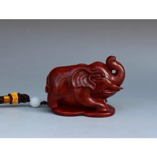 Lobular red sandalwood elephants hand playing pieces mahogany wood crafts ornaments Man playing the piece of wood