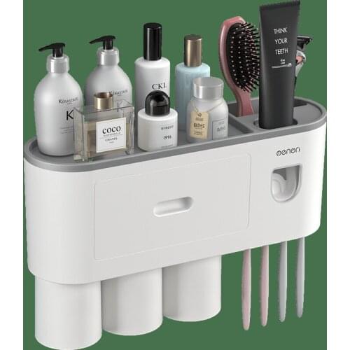 2021 Magnetic adsorption inverted toothbrush holder with dual automatic toothpaste squeezer dispenser storage rack