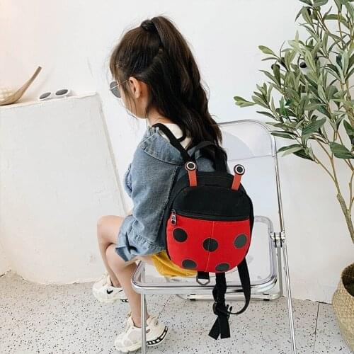 Cartoon shoulder canvas bag 2020 new cute kindergarten baby men and women messenger bag three-color patch funny ugly small bag