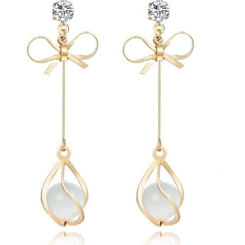 Korean edition fashionable bow cats eye stone tassels Earrings simple chaotic eardrops Creativity long temperament