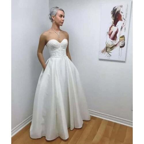 Elegant Satin A Line Wedding Dresses Sweetheart Appliques Bridal Gowns With Pocket Garden Simple Sweep Train Wedding Gowns