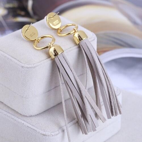 Inlaid white natural stone leather tassel long earrings