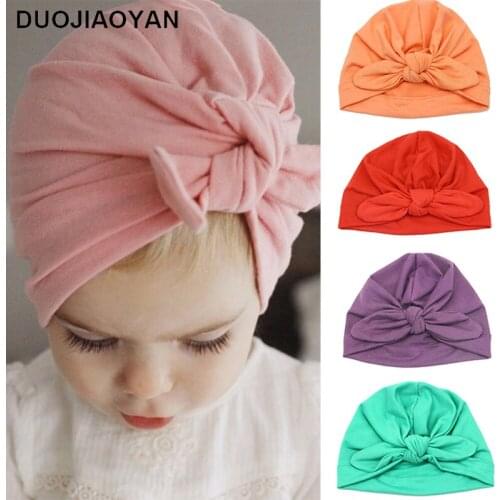 DUOJIAOYAN European and American baby products baby hat rabbit ears knotted cap hat Indian hat milk silk children hat